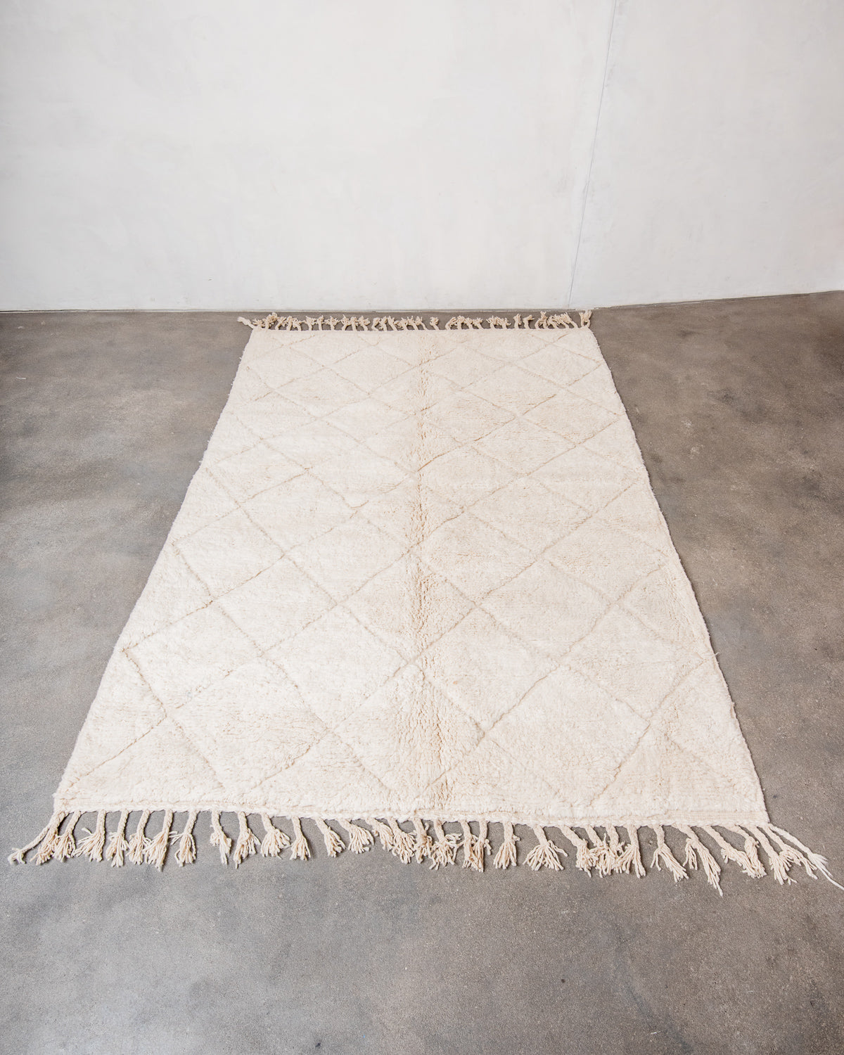 Modern, designer, handcrafted Berber rug from Morocco. Beniourain carpet with minimalist design, natural wool pile and a fluffy texture.